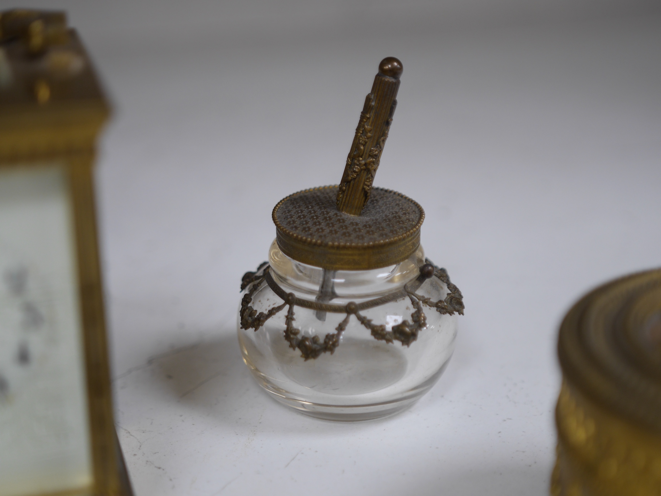 A brass cased carriage clock and five ormolu mounted glass desk accessories, clock 12cm high. Condition - unknown if clock working, desk accessories fair to good condition.